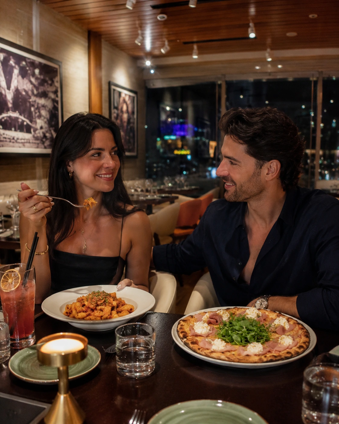Man and woman dining at Aventura Mall with pasta and pizza
